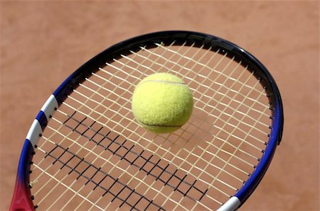 Tennis ball on a racket Stock Photo - Budget Royalty-Free & Subscription, Code: 400-05058898