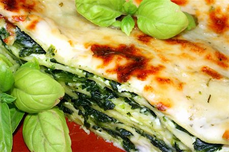 simsearch:400-04736238,k - Vegetarian lasagna with ricotta cheese spinach filling and basil Stock Photo - Budget Royalty-Free & Subscription, Code: 400-05059209