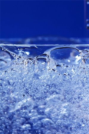 simsearch:400-04026996,k - Glass sparkling water on blue background Stock Photo - Budget Royalty-Free & Subscription, Code: 400-05059349