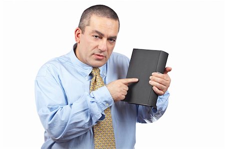 simsearch:400-04963726,k - Serious business man holding a book over a white background Stock Photo - Budget Royalty-Free & Subscription, Code: 400-05059525