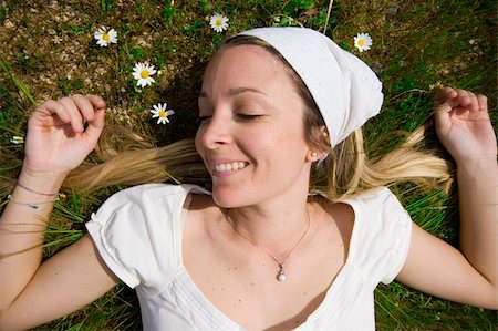 dreaming cloud girl - smiling girl relaxing and having fun on a bed of grass. Stock Photo - Budget Royalty-Free & Subscription, Code: 400-05059739