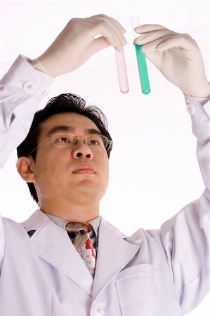 racnus (artist) - Asian doctor with test tube in white background. Fotografie stock - Microstock e Abbonamento, Codice: 400-05059801