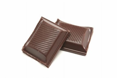 Two segments of chocolate on a white background Stockbilder - Microstock & Abonnement, Bildnummer: 400-05050124