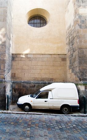 funny truck transport - A humorous image of a cargo truck parked between two large buttresses at the St. Giles Church, Prague, Czech Republic. Stock Photo - Budget Royalty-Free & Subscription, Code: 400-05050612