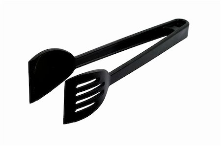 A pair of black kitchen tongs you can find in most kitchens. Stock Photo - Budget Royalty-Free & Subscription, Code: 400-05050674