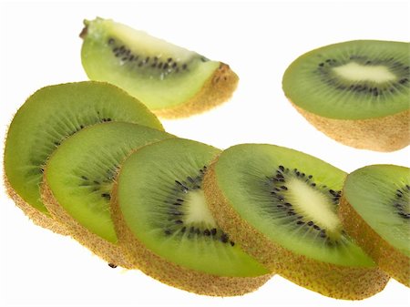 A sliced kiwi fruit, isolated on white Stock Photo - Budget Royalty-Free & Subscription, Code: 400-05051412