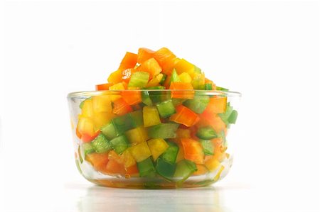A glass bowl with chopped orange, green, and yellow peppers Foto de stock - Royalty-Free Super Valor e Assinatura, Número: 400-05051555