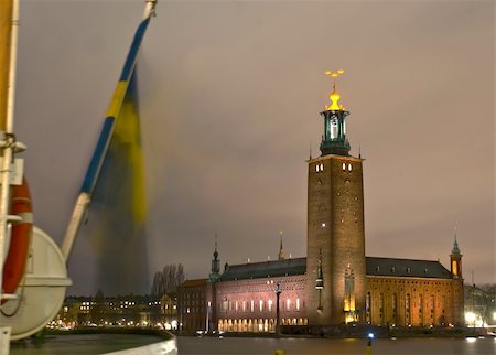 stockholm city hall - Stockholm City Hall as seen from Riddarholmen. Cloudy sky, windy and no snow, temperature +2 Celsius. Stockholm City Hall spreads some light and makes the terrible Swedish winter night a little bit easier to endure.    This is where the annual Nobel Prize banquet is held on December 10. Stock Photo - Budget Royalty-Free & Subscription, Code: 400-05051759