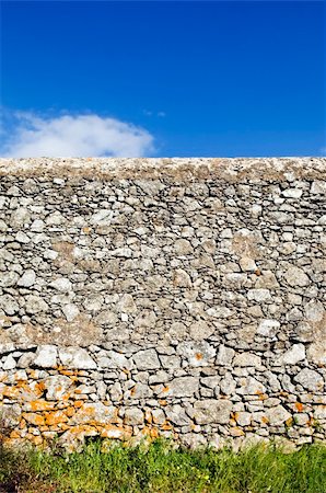 Ancient rustic stone wall beautifully preserved in a shiny day Stock Photo - Budget Royalty-Free & Subscription, Code: 400-05051766