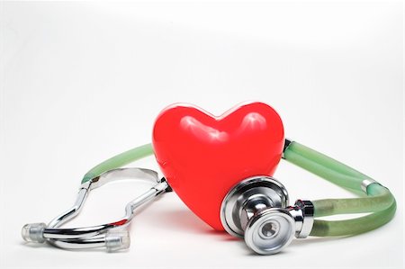 A red heart shape and a medical stethoscope. Stock Photo - Budget Royalty-Free & Subscription, Code: 400-05051875