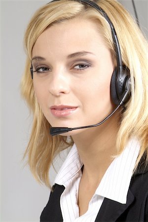 simsearch:400-03943051,k - a friendly woman with blond hair and headphone Stock Photo - Budget Royalty-Free & Subscription, Code: 400-05051970