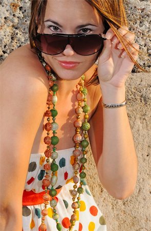 peeping fashion - Portrait of Fashion model with sunglasses in summer clothes Photographie de stock - Aubaine LD & Abonnement, Code: 400-05052110