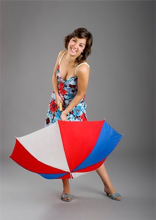simsearch:400-03996893,k - Portrait of a young happy woman posing with an umbrella Stock Photo - Budget Royalty-Free & Subscription, Code: 400-05052239