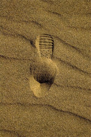 shoe treads - Detail of a footprint in the sand Stock Photo - Budget Royalty-Free & Subscription, Code: 400-05052359