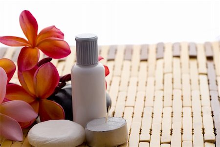 Aromatherapy and spa massage on tropical bamboo and polished stones. Stockbilder - Microstock & Abonnement, Bildnummer: 400-05052392