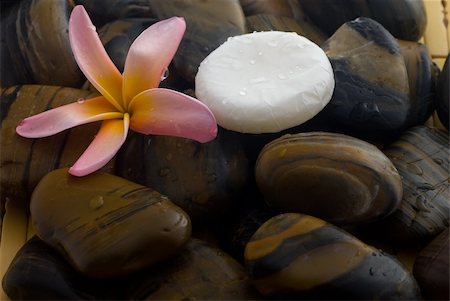 Aromatherapy and spa massage on tropical bamboo and polished stones. Stockbilder - Microstock & Abonnement, Bildnummer: 400-05052405