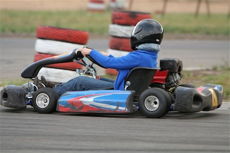 Girl in racing kart with number one Stock Photo - Budget Royalty-Free & Subscription, Code: 400-05052518