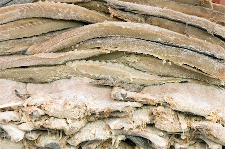 Pile of dried and salted codfish fillets Fotografie stock - Microstock e Abbonamento, Codice: 400-05052733