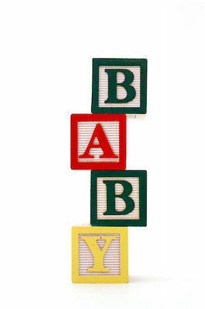 word baby formed by alphabet wood blocks on a white surface Foto de stock - Super Valor sin royalties y Suscripción, Código: 400-05052909