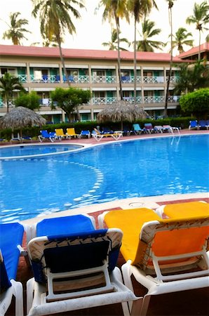 simsearch:400-08671578,k - Swimming pool and chairs at tropical resort Stock Photo - Budget Royalty-Free & Subscription, Code: 400-05052951