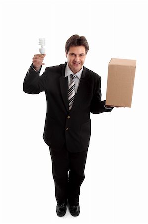 Think outside the box...  A business man balancing a box in one hand and holding an energy efficient light bulb in the other.     eg  ideas, lateral thinking, different perspective, unconventional,  eco  energy, innovation, environment related issues or challenges for business. Stockbilder - Microstock & Abonnement, Bildnummer: 400-05053242