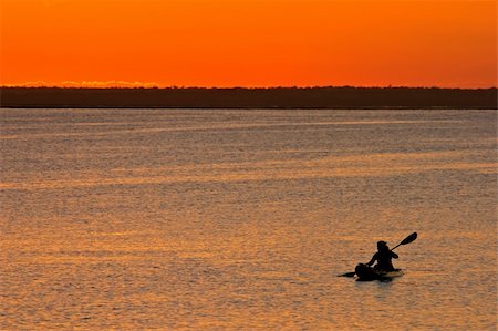 Golden sunset with canoeist, Vilanculos coastal sanctuary, Mozambique Stock Photo - Budget Royalty-Free & Subscription, Code: 400-05064055