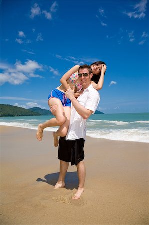 eyedear (artist) - young multiethnic couple enjoying themselves on a beautiful day at the beach Stock Photo - Budget Royalty-Free & Subscription, Code: 400-05064260