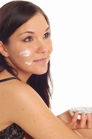 simsearch:400-04127590,k - attractive brunette woman applying cream Stock Photo - Budget Royalty-Free & Subscription, Code: 400-05064528