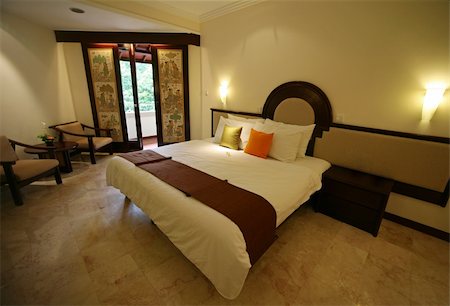 simsearch:400-07302319,k - Nice bedroom with the big bed. Hotel Kartika. Bali Foto de stock - Royalty-Free Super Valor e Assinatura, Número: 400-05064765