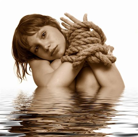 simsearch:400-04060285,k - beaty girl with connected hands by string, flooding the white Fotografie stock - Microstock e Abbonamento, Codice: 400-05065009