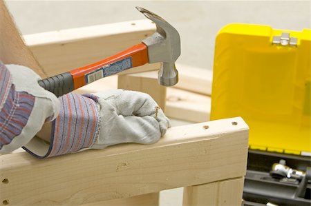 simsearch:640-02773025,k - man with safety gloves holding screw and hammer Stock Photo - Budget Royalty-Free & Subscription, Code: 400-05065339