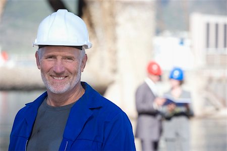 people working on oil rig - Engineer with hard hat and business people behind him standing on an oil rig Stock Photo - Budget Royalty-Free & Subscription, Code: 400-05066367