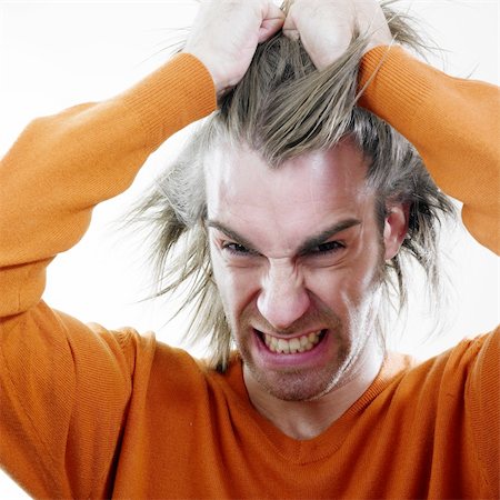 simsearch:400-07681479,k - Angry handsome young man pulling his hair. Stock Photo - Budget Royalty-Free & Subscription, Code: 400-05066675