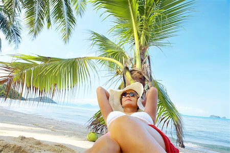 View of nice woman having fun on tropical beach Stock Photo - Budget Royalty-Free & Subscription, Code: 400-05067407