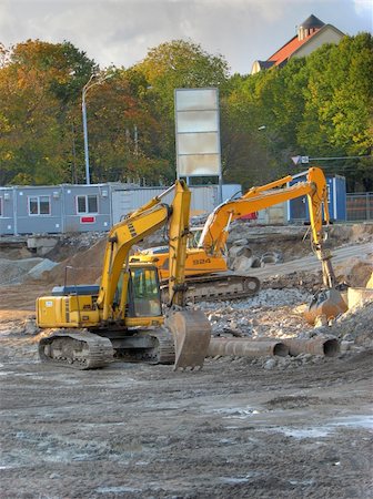 two bulldozers at building site making preparations for the house Stock Photo - Budget Royalty-Free & Subscription, Code: 400-05067555