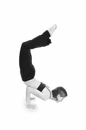 Young female gymnast practicing yoga. Foto de stock - Royalty-Free Super Valor e Assinatura, Número: 400-05067571
