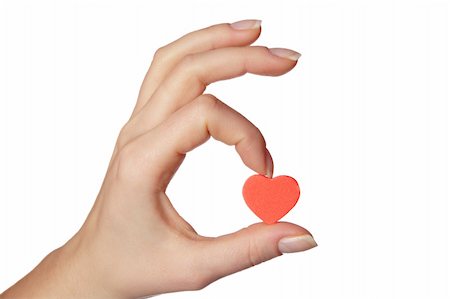 simsearch:400-04334934,k - Female hand holding little red heart.Isolated on white background. Stock Photo - Budget Royalty-Free & Subscription, Code: 400-05067600