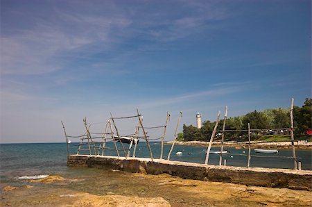 sandy hook - Croatian shore, wooden holders used for lifting boats Stock Photo - Budget Royalty-Free & Subscription, Code: 400-05067856