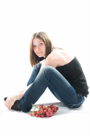simsearch:400-04564926,k - Beautiful young woman with red grape. Isolated Photographie de stock - Aubaine LD & Abonnement, Code: 400-05068228