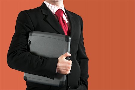simsearch:400-08111295,k - Businessman holding a laptop Stock Photo - Budget Royalty-Free & Subscription, Code: 400-05068285