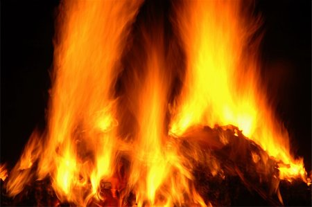 simsearch:400-07420416,k - Fiery hot flame blazing with dark background Photographie de stock - Aubaine LD & Abonnement, Code: 400-05068396