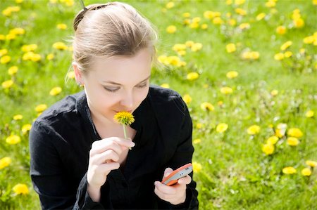 Phone And Flower. Young Woman On The Meadow. Stock Photo - Budget Royalty-Free & Subscription, Code: 400-05068539