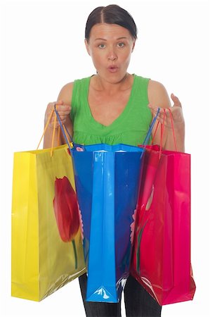simsearch:400-07318724,k - attractive brunette woman with shopping bags on white background Fotografie stock - Microstock e Abbonamento, Codice: 400-05069102