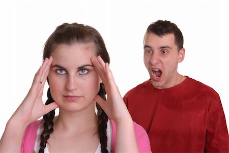 simsearch:400-08338944,k - young man shouting at young lady who has a headache - humorous concept, isolated on white Stock Photo - Budget Royalty-Free & Subscription, Code: 400-05069354