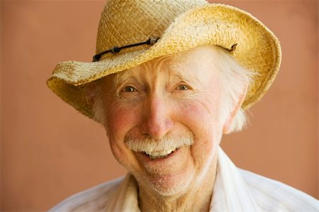 Senior Citizen Man Smiling in a Straw Cowboy Hat Stock Photo - Budget Royalty-Free & Subscription, Code: 400-05069618