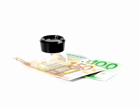 simsearch:400-07087821,k - euros bills and a lupe on white background Stock Photo - Budget Royalty-Free & Subscription, Code: 400-05069707