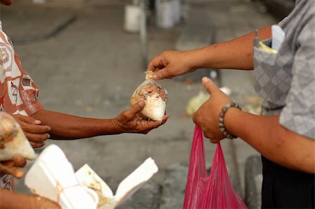 Hands of some street beggars beg for food and arms. Stock Photo - Budget Royalty-Free & Subscription, Code: 400-05069716