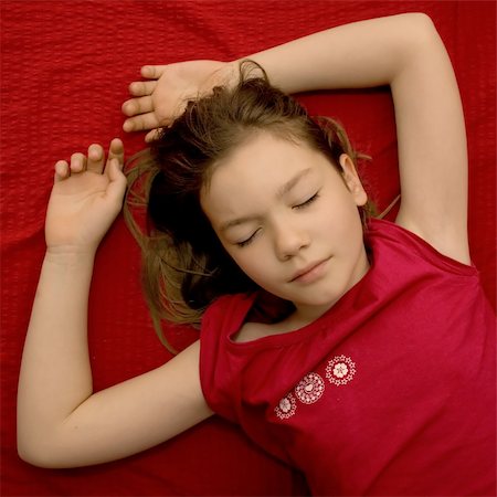 Sleeping young girl in red bed and red shirt Stock Photo - Budget Royalty-Free & Subscription, Code: 400-05069999