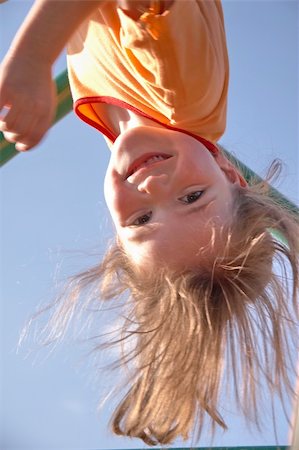 Child playing at a climbing pole Stock Photo - Budget Royalty-Free & Subscription, Code: 400-05060036