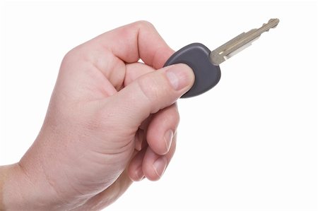 The man's hand holds key for the new car. Isolated on white. Stock Photo - Budget Royalty-Free & Subscription, Code: 400-05060378
